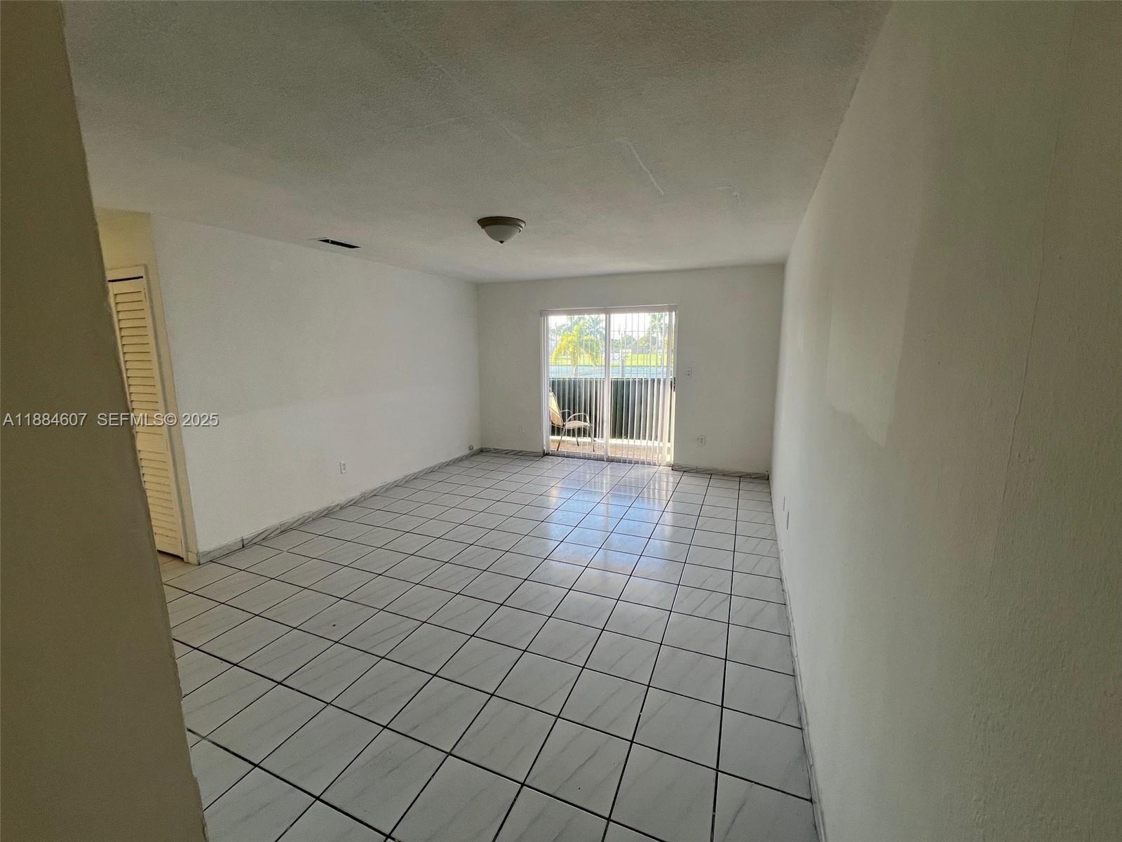 887 West 29th Street, Unit 1 Hialeah, FL 33012 - Photo 1 of 8 a view of an empty room and window