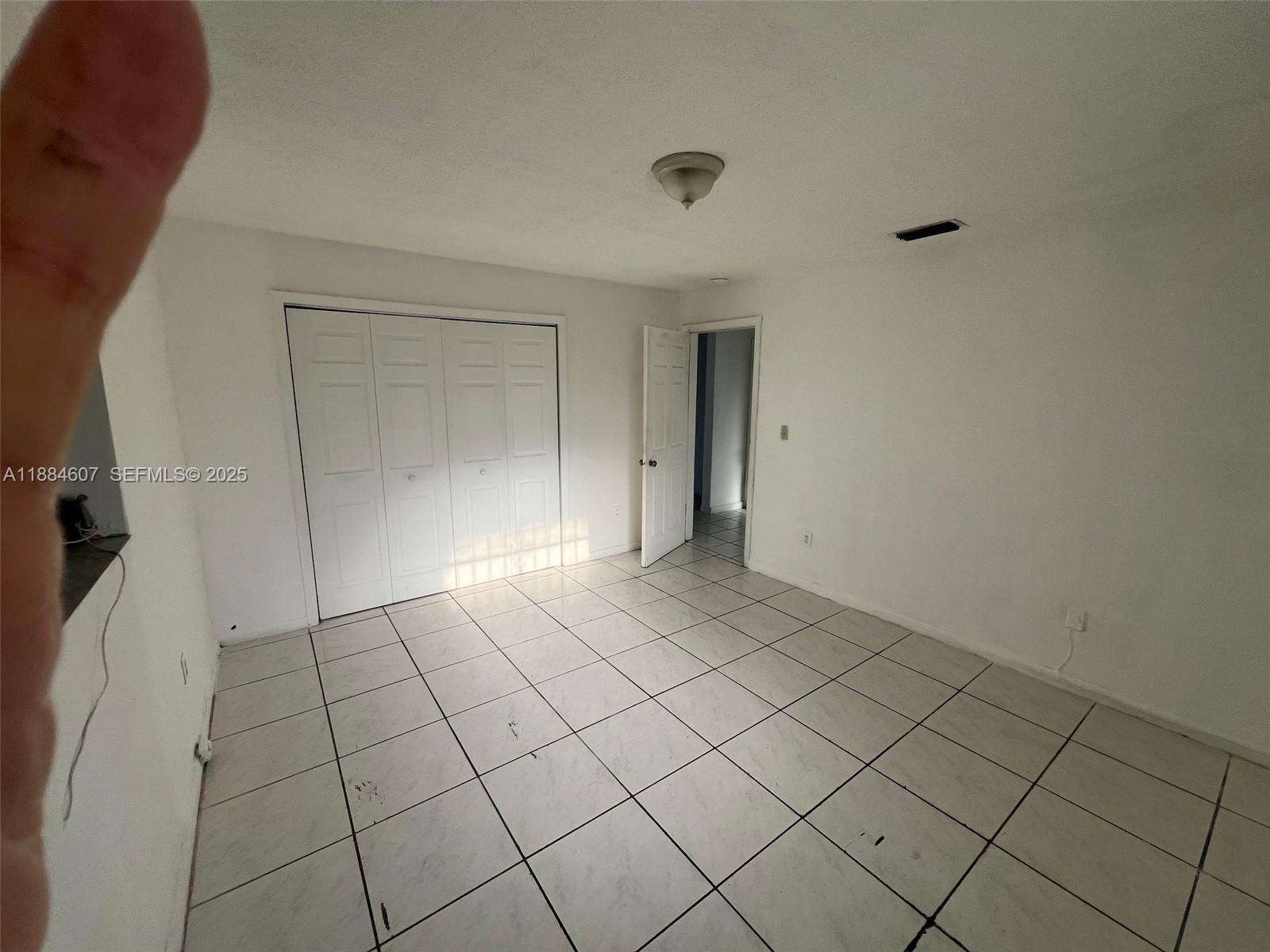 887 West 29th Street, Unit 1 Hialeah, FL 33012 - Photo 4 of 8 a view of an empty room