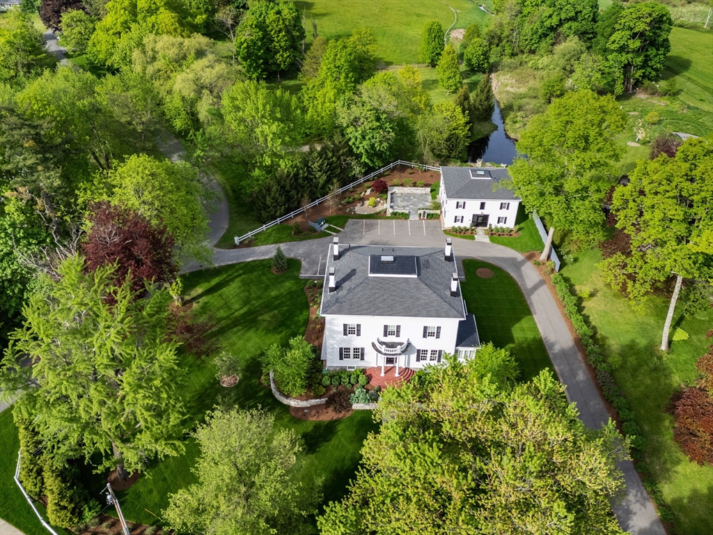 an aerial view of a house with yard swimming pool and outdoor seating