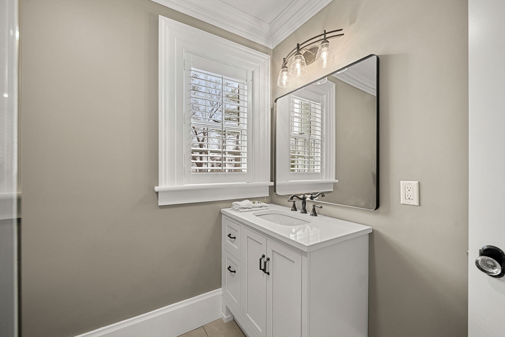186 Main Street Groton, MA 01450 - Photo 16 of 42 a bathroom with a sink a vanity and a mirror