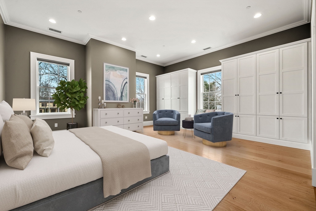 186 Main Street Groton, MA 01450 - Photo 20 of 42 a spacious bedroom with a large bed couch and windows