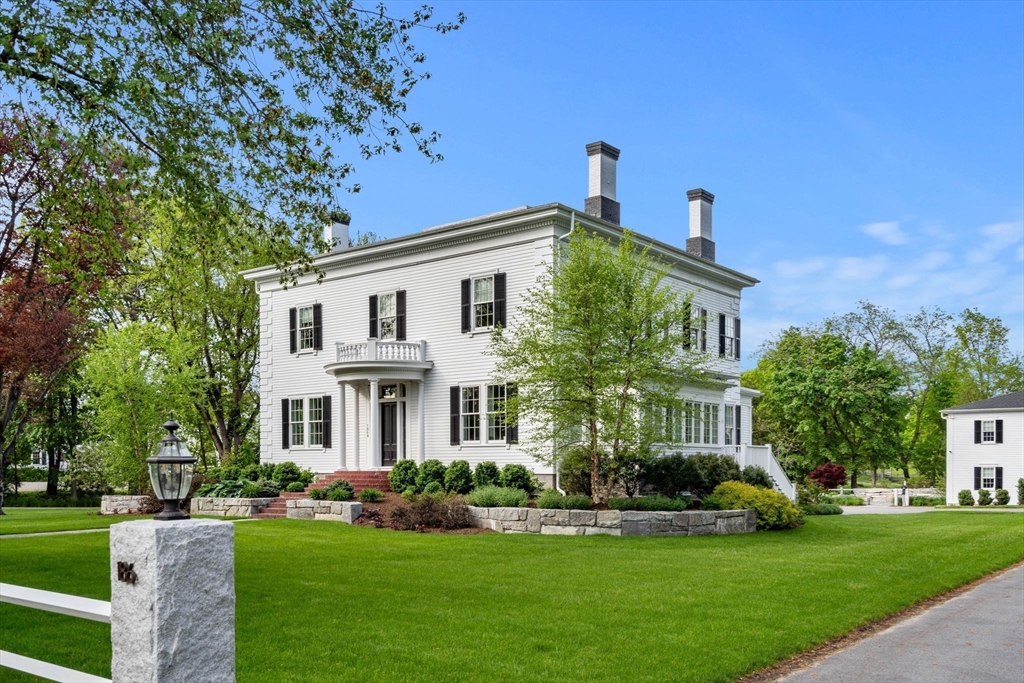 186 Main Street Groton, MA 01450 - Photo 2 of 42 a front view of a house with a yard