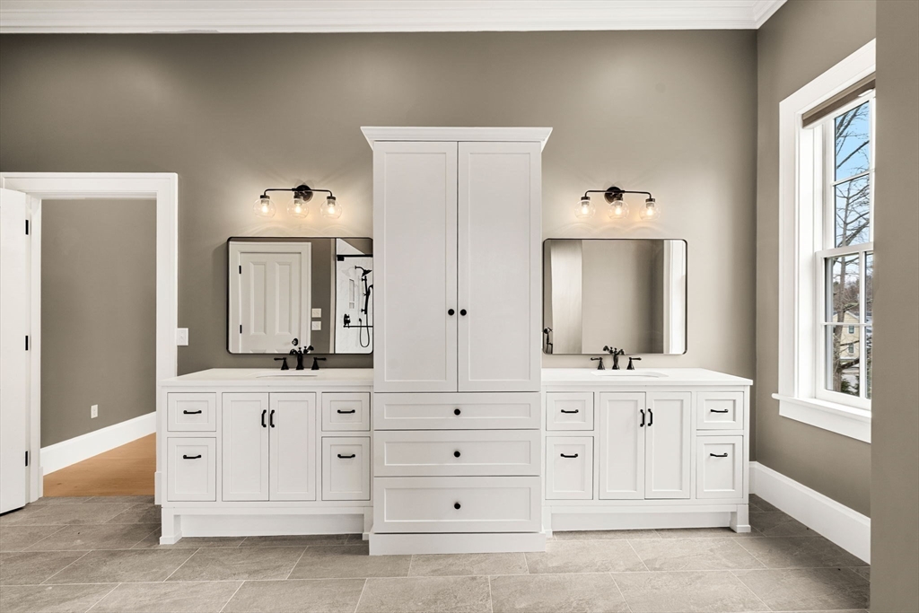 186 Main Street Groton, MA 01450 - Photo 22 of 42 a bathroom with a double vanity sink and mirror
