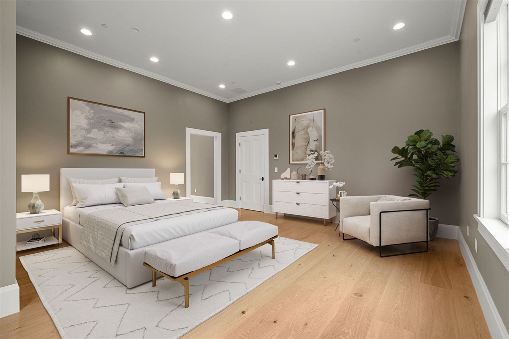 186 Main Street Groton, MA 01450 - Photo 25 of 42 a spacious bedroom with a large bed and a couch