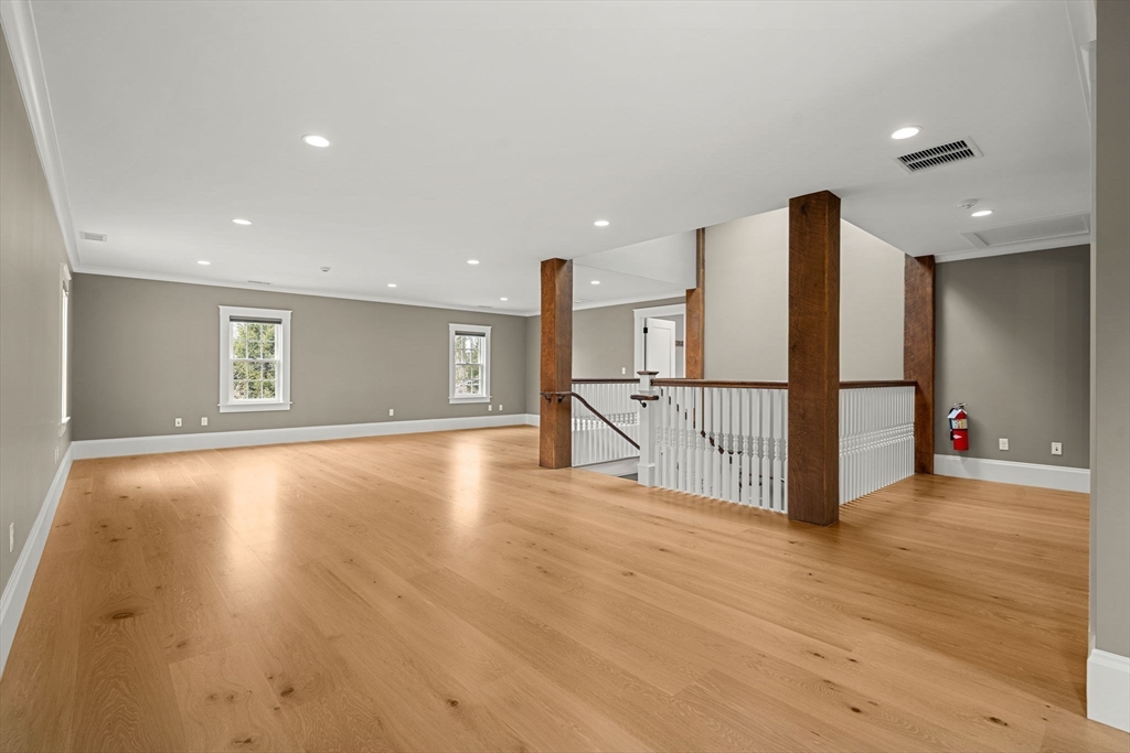 186 Main Street Groton, MA 01450 - Photo 36 of 42 a view of an empty room with wooden floor and a window
