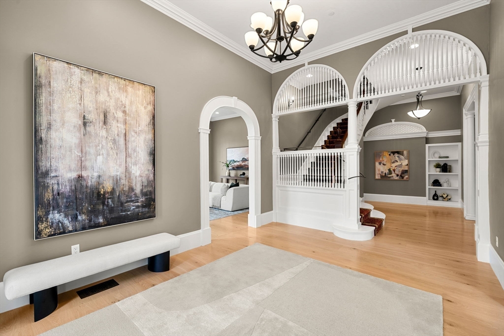 186 Main Street Groton, MA 01450 - Photo 4 of 42 a living room with furniture and a chandelier