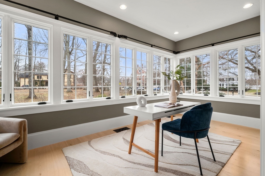186 Main Street Groton, MA 01450 - Photo 8 of 42 a view of a dining room with furniture large windows and wooden floor
