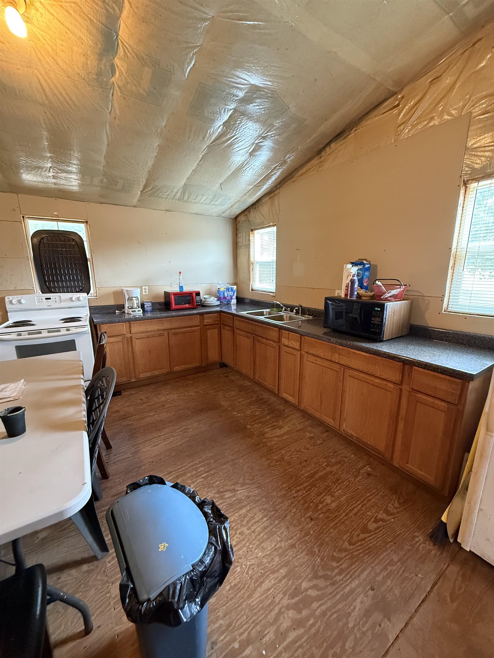 225 Teague Road Toone, TN 38381 - Photo 13 of 13 a kitchen with stainless steel appliances granite countertop a sink a stove counter space and cabinets