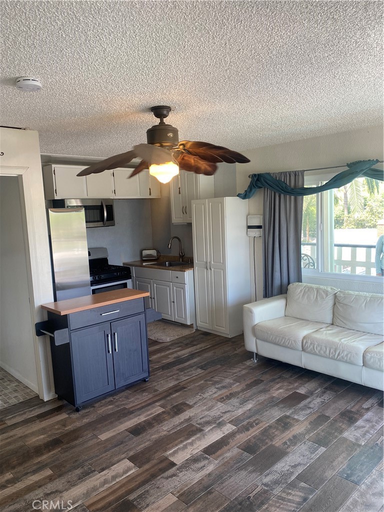808 Orchard Drive, Unit B Redlands, CA 92374 - Photo 8 of 11 a living room with furniture and a wooden floor