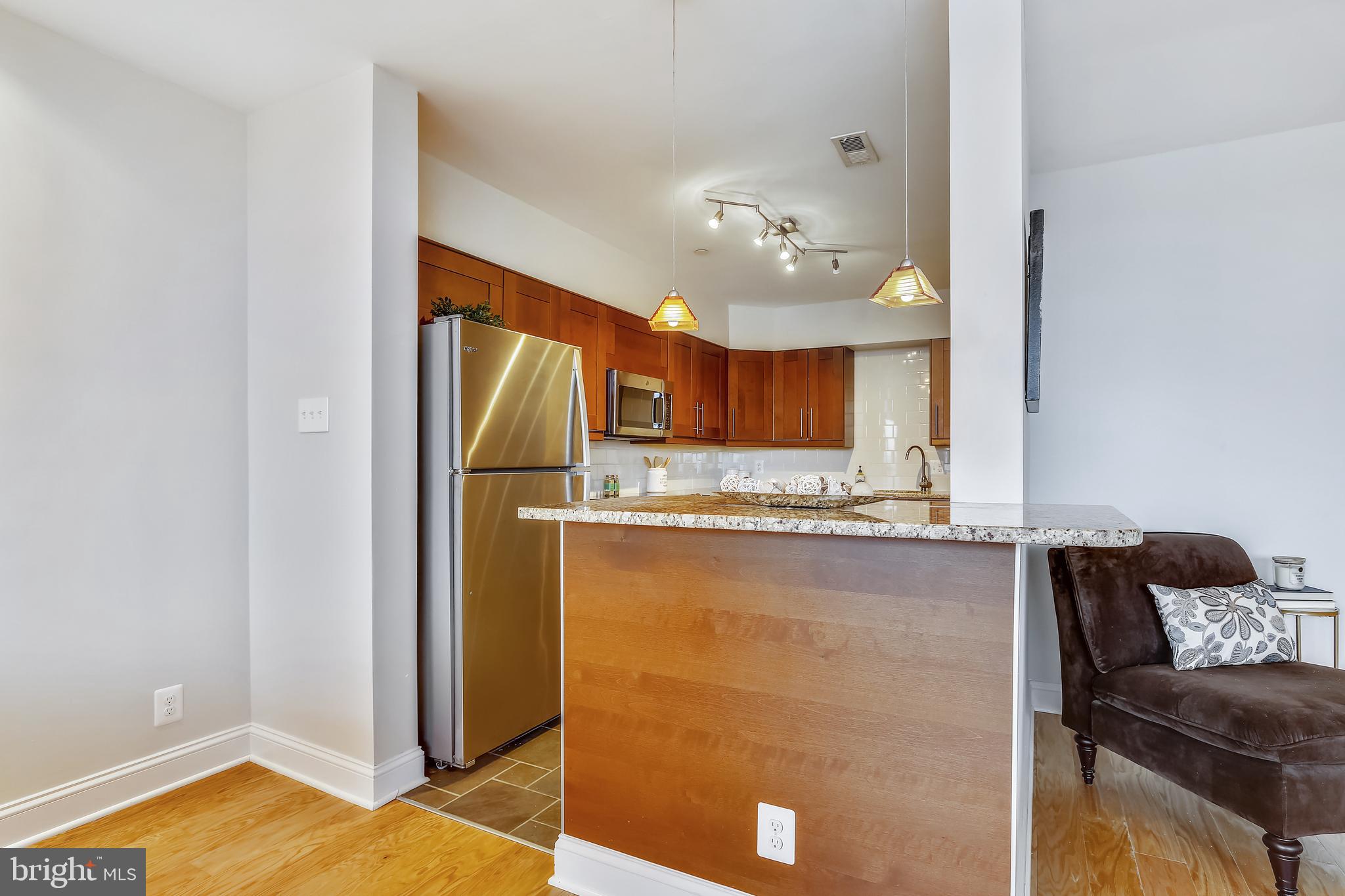 5501 Seminary Road, Unit 2615S Falls Church, VA 22041 - Photo 10 of 41 Breakfast bar w/pendant lighting & seating