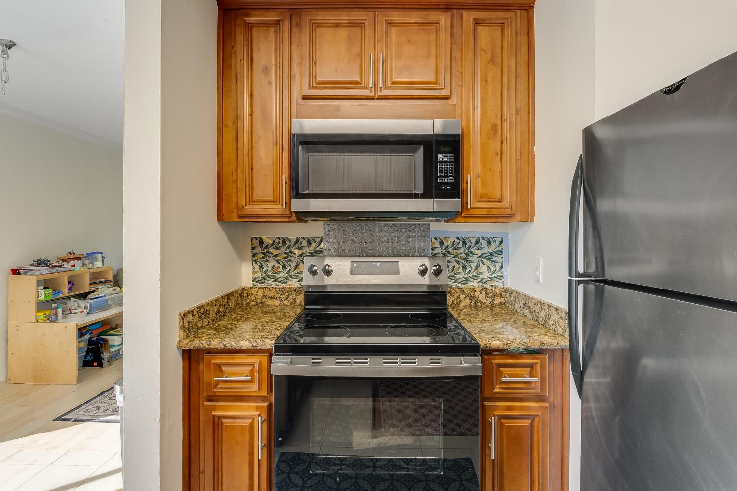 1699 Laguna Street, Unit 302 Concord, CA 94520 - Photo 11 of 30 a kitchen with a stove and a microwave