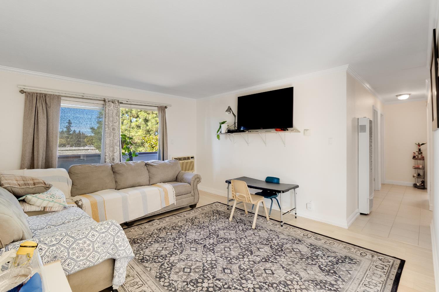 1699 Laguna Street, Unit 302 Concord, CA 94520 - Photo 13 of 30 a living room with furniture and a flat screen tv