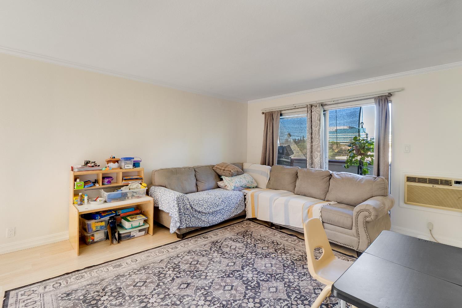 1699 Laguna Street, Unit 302 Concord, CA 94520 - Photo 14 of 30 a living room with furniture and a window