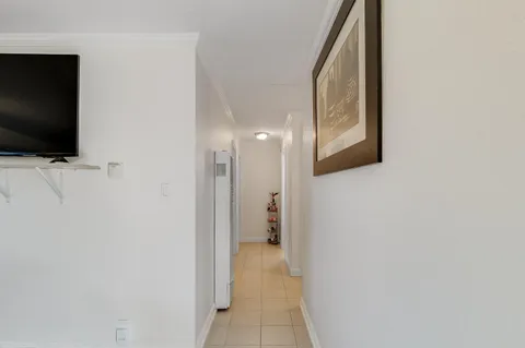 a bedroom with a bed and ceiling fan