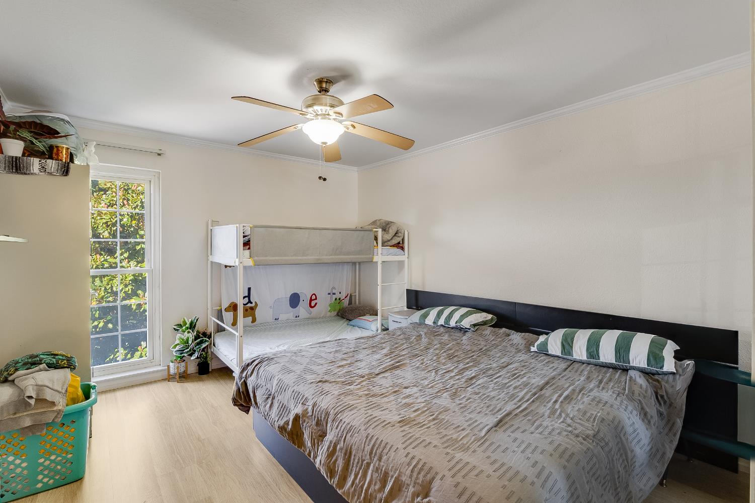 1699 Laguna Street, Unit 302 Concord, CA 94520 - Photo 17 of 30 a bedroom with a bed and ceiling fan