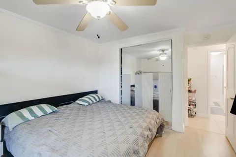 a bathroom with a granite countertop sink a large mirror and shower