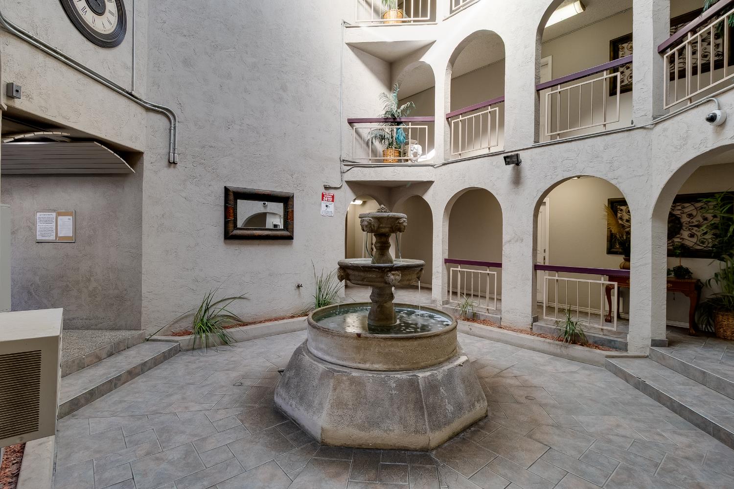 1699 Laguna Street, Unit 302 Concord, CA 94520 - Photo 4 of 30 a living room with fireplace furniture and a potted plant