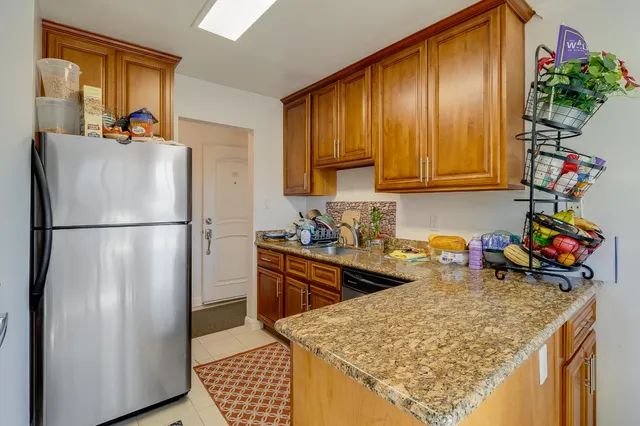 a kitchen with a sink and a refrigerator