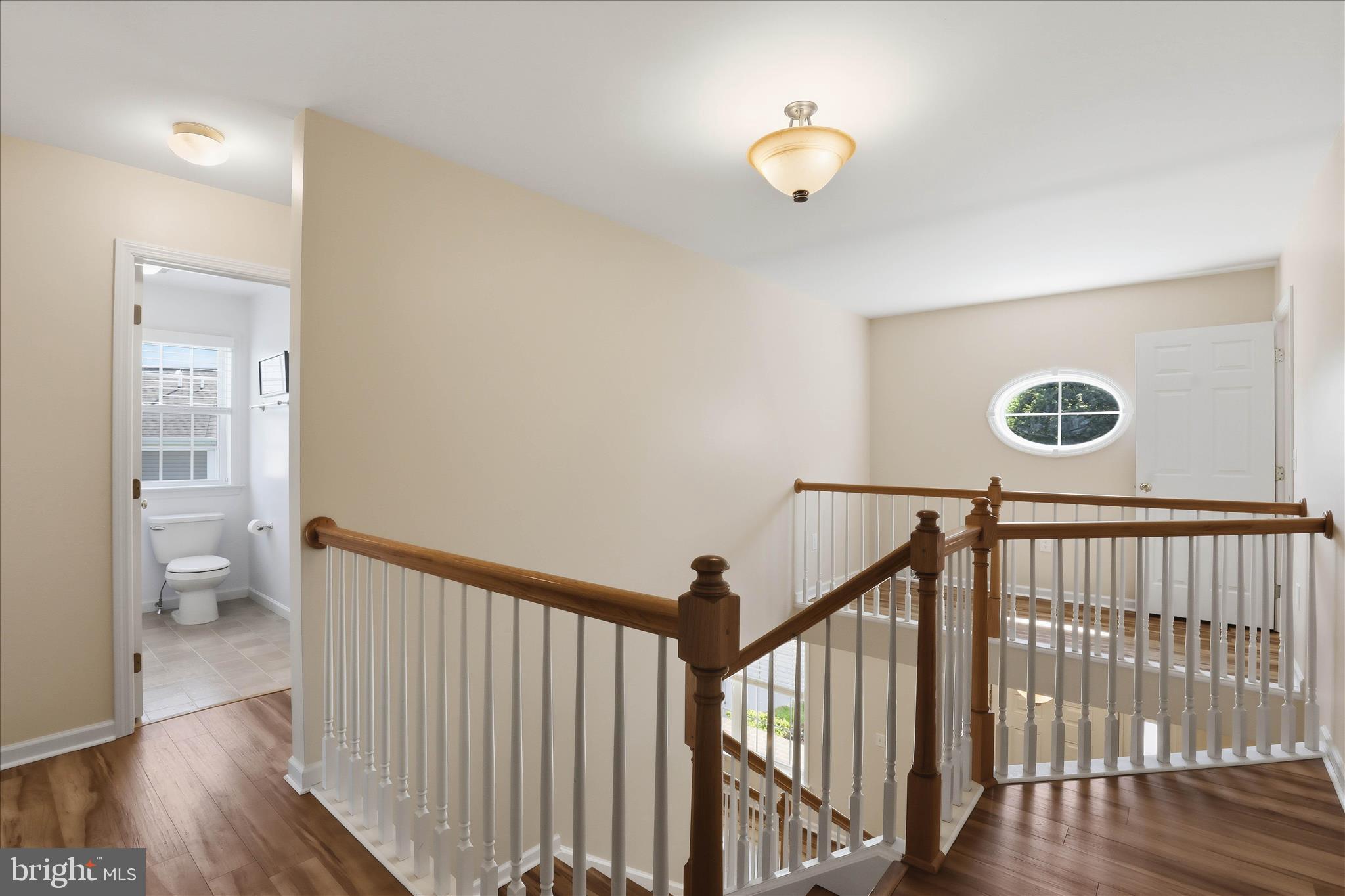 533 Thornberry Lane Lititz, PA 17543 - Photo 37 of 56 a view of a hallway with wooden floor and a bathroom