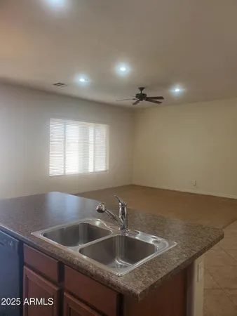 a view of a sink a counter top space in the room