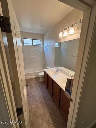 a bathroom with sink vanity and mirror