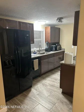 a large bathroom with a double vanity sink and mirror