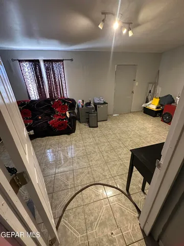 a bedroom with a bed and a chair in it