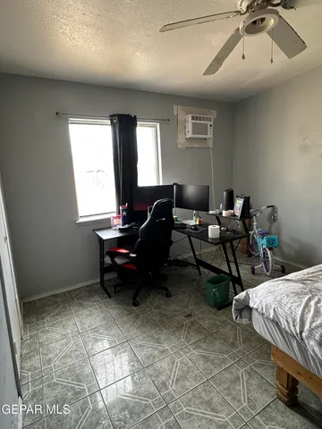 a bedroom with bed and window