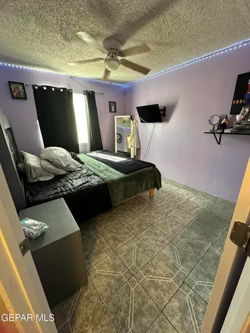 a bedroom with furniture and a chandelier
