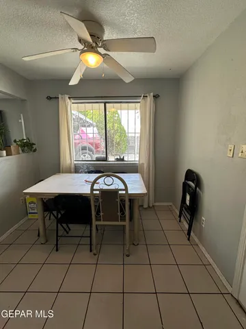 a kitchen with a sink a stove and a refrigerator