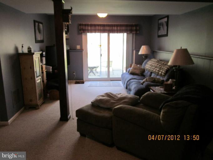 890 Maple Tree Road Severn, MD 21144 - Photo 14 of 15 a living room with furniture and a large window