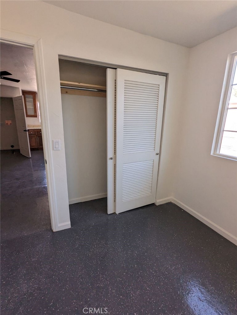 2886 Cridge Street Riverside, CA 92507 - Photo 16 of 21 a view of empty room with wooden floor and window