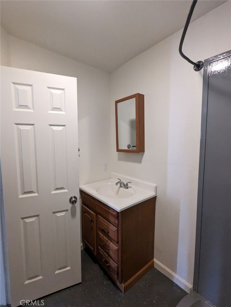 2886 Cridge Street Riverside, CA 92507 - Photo 17 of 21 a bathroom with a sink toilet and mirror