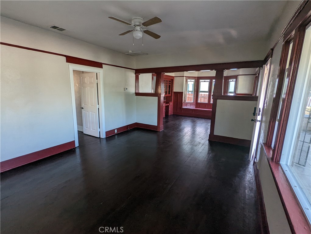 2886 Cridge Street Riverside, CA 92507 - Photo 2 of 21 an empty room with wooden floor and windows