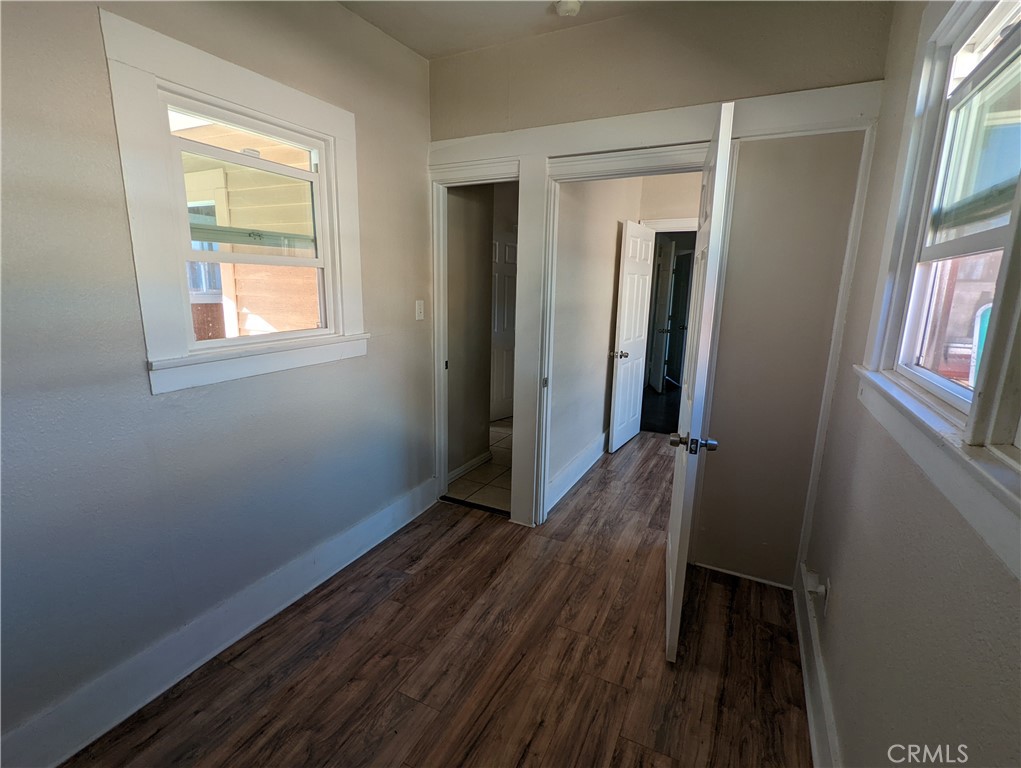 2886 Cridge Street Riverside, CA 92507 - Photo 6 of 21 a view of hallway with window and wooden floor