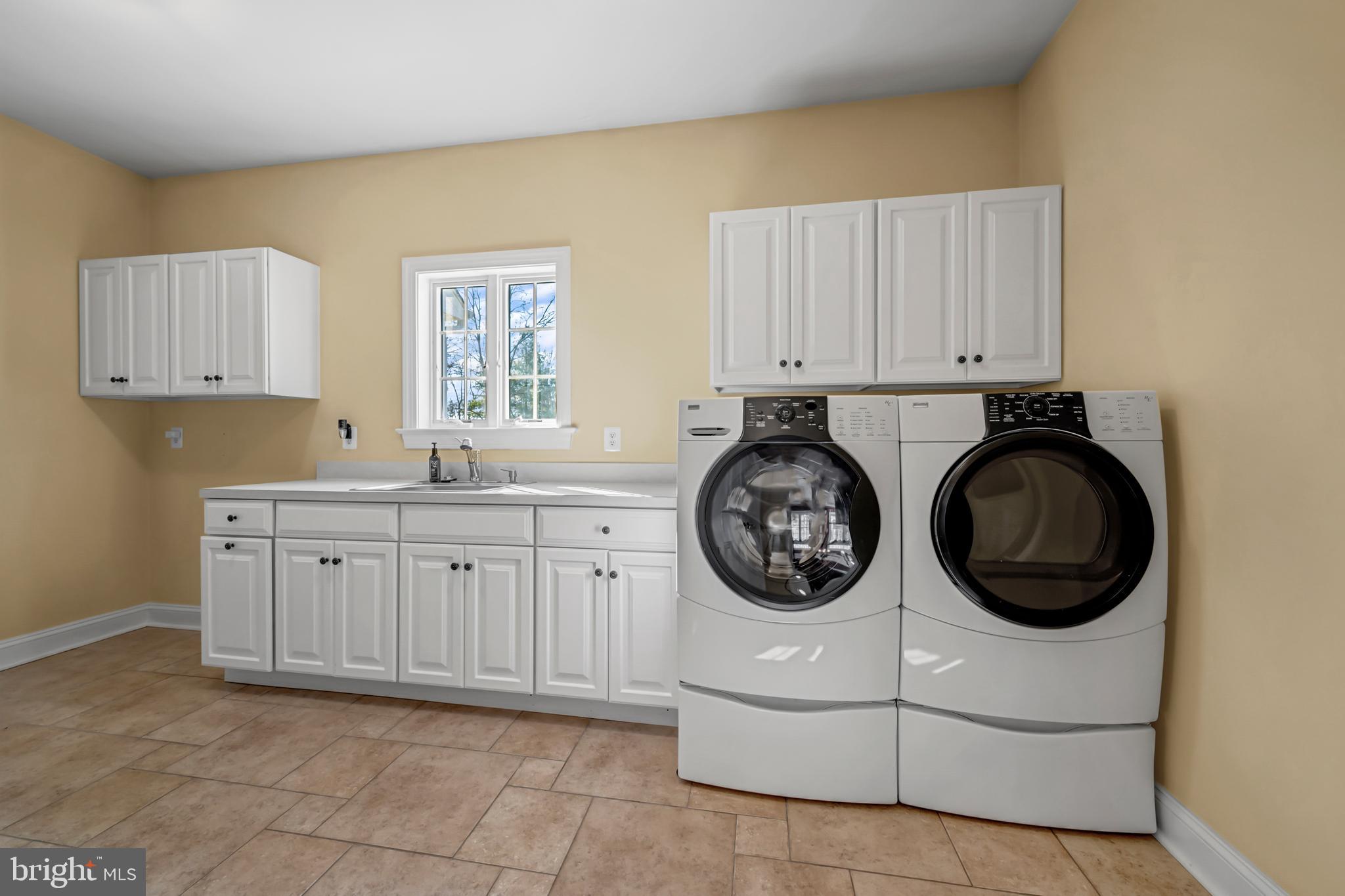 8986 Woodward Road Marshall, VA 20115 - Photo 19 of 45 a utility room with sink dryer and washer