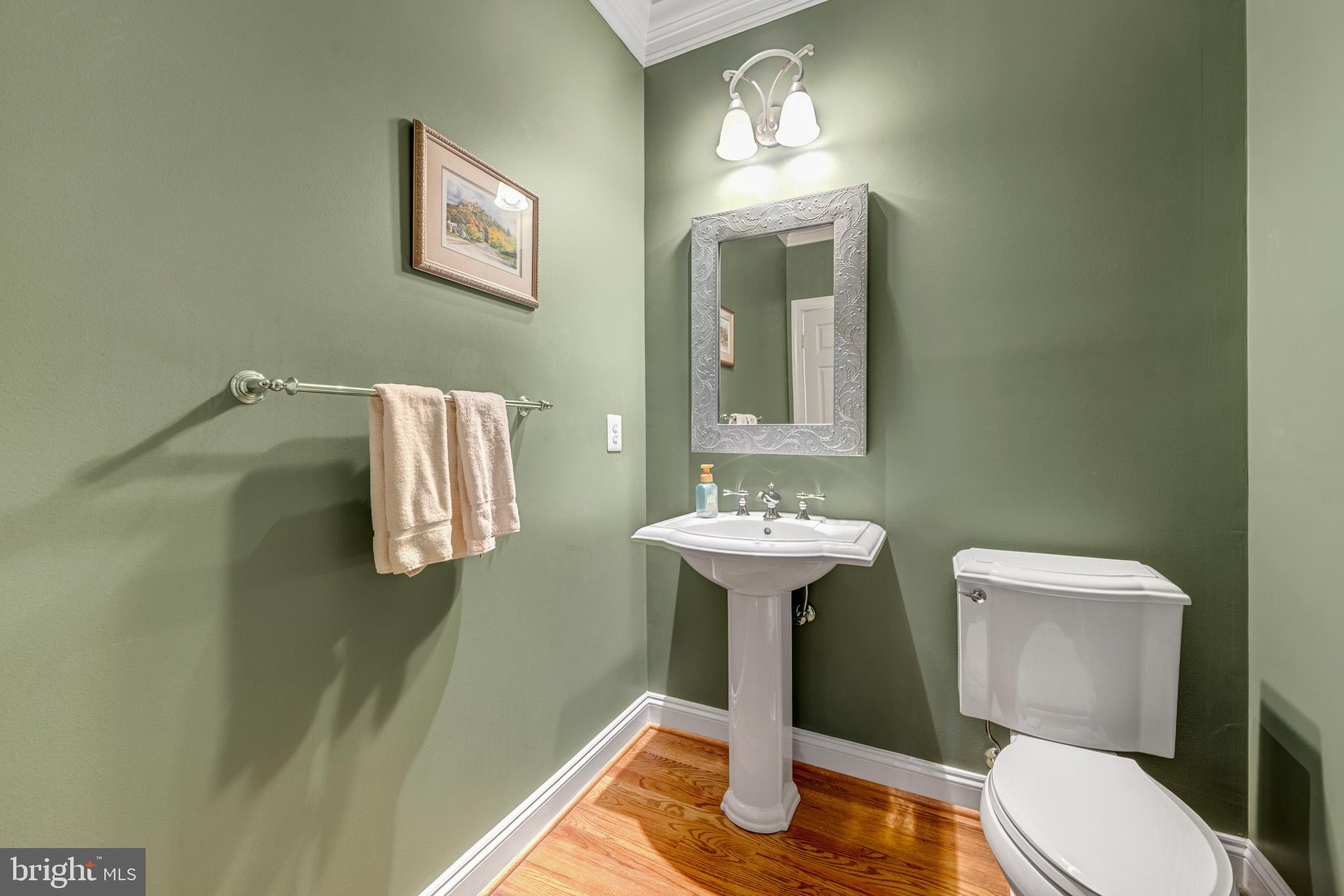 8986 Woodward Road Marshall, VA 20115 - Photo 20 of 45 a bathroom with a toilet sink and mirror