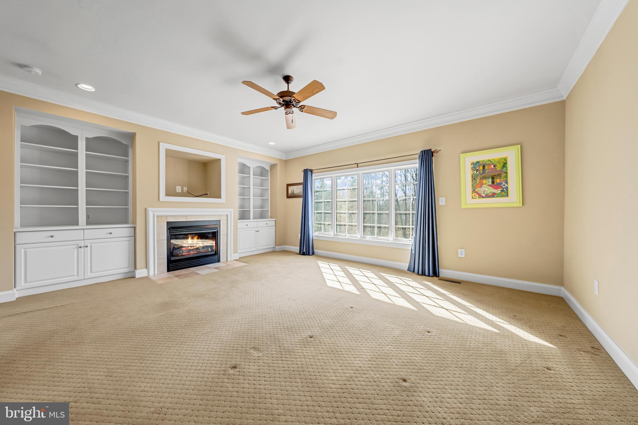 8986 Woodward Road Marshall, VA 20115 - Photo 21 of 45 a view of an empty room with a fireplace and a window