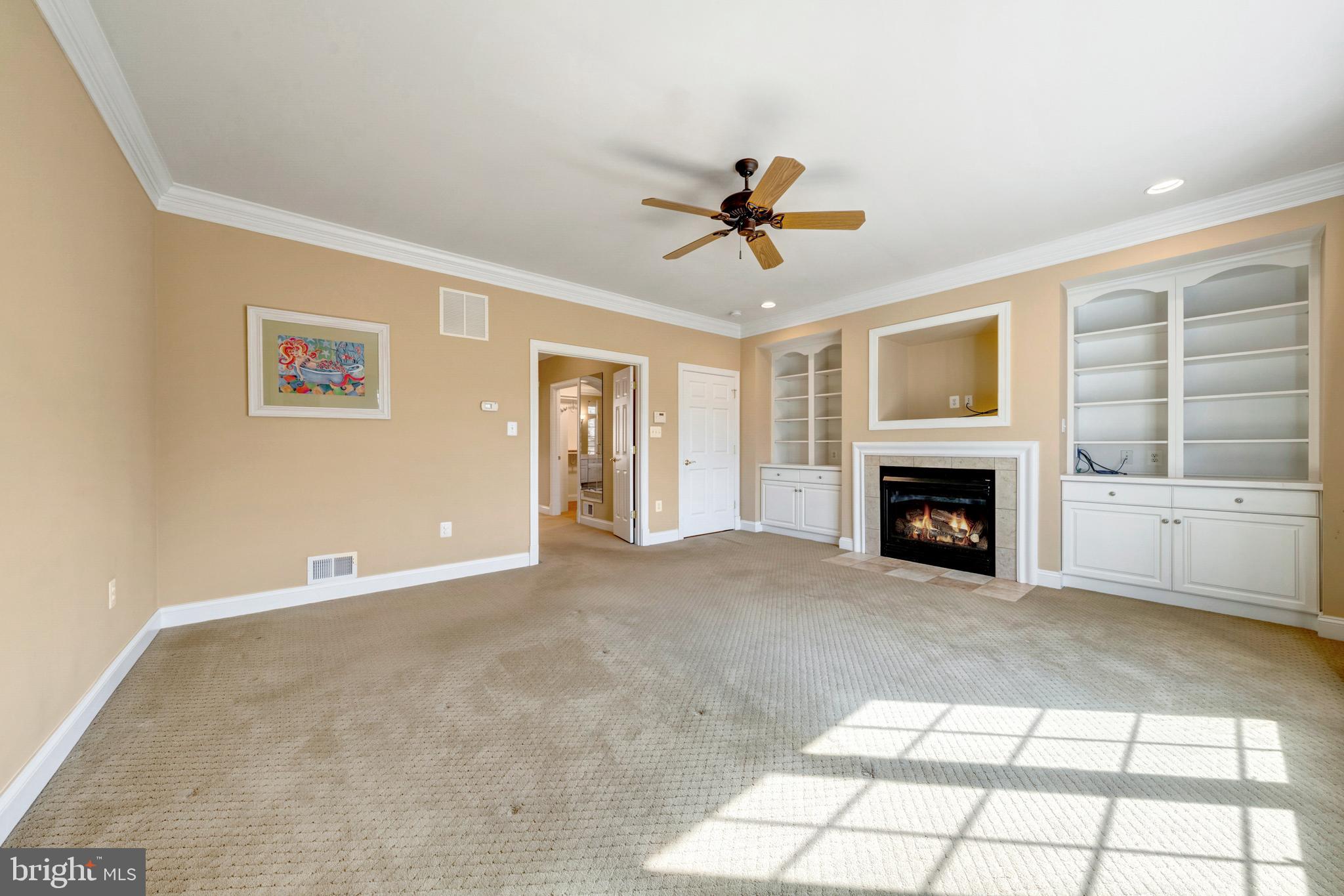 8986 Woodward Road Marshall, VA 20115 - Photo 22 of 45 a view of an empty room with a fireplace and a window