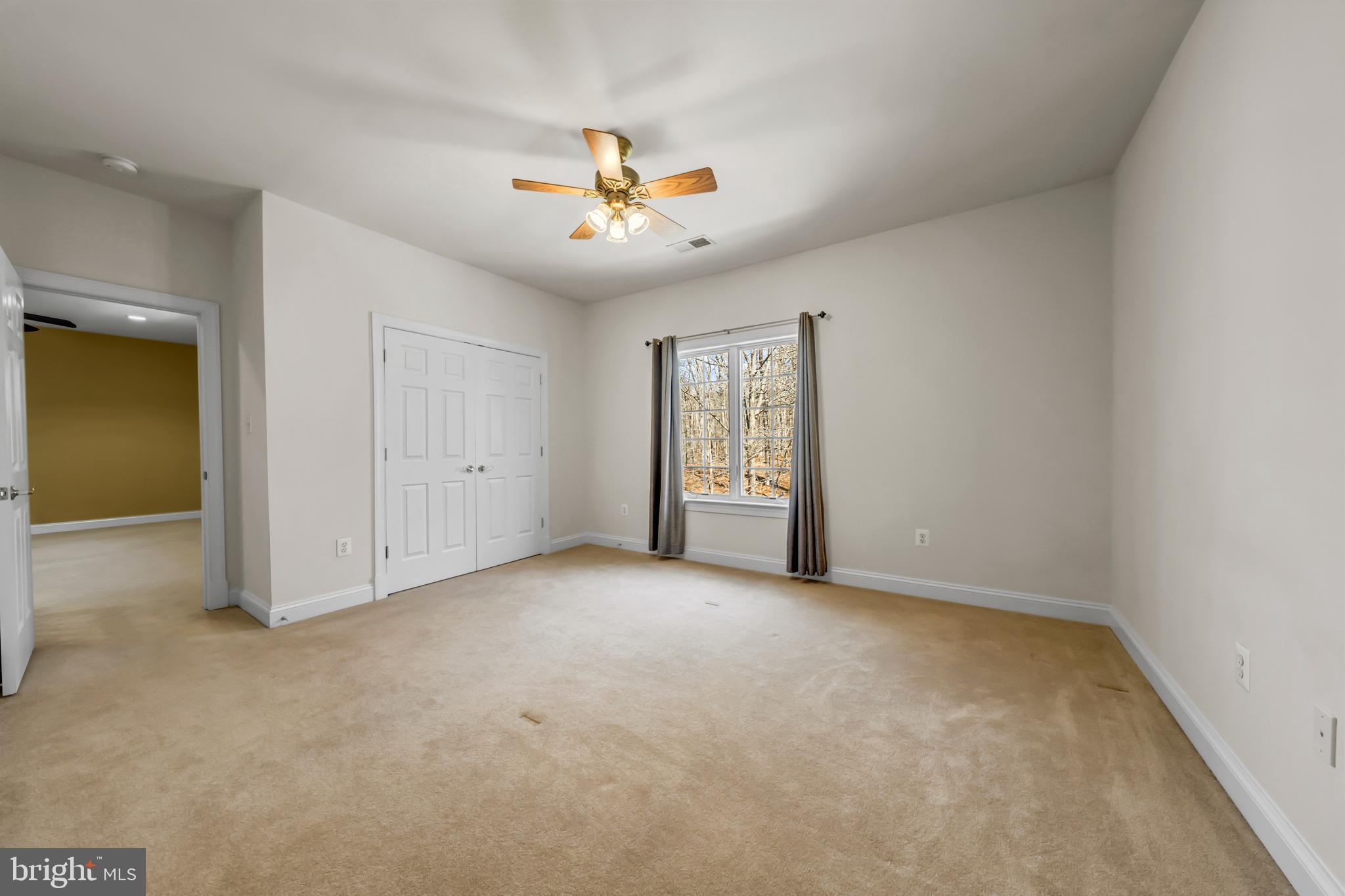 8986 Woodward Road Marshall, VA 20115 - Photo 29 of 45 an empty room with windows and fan