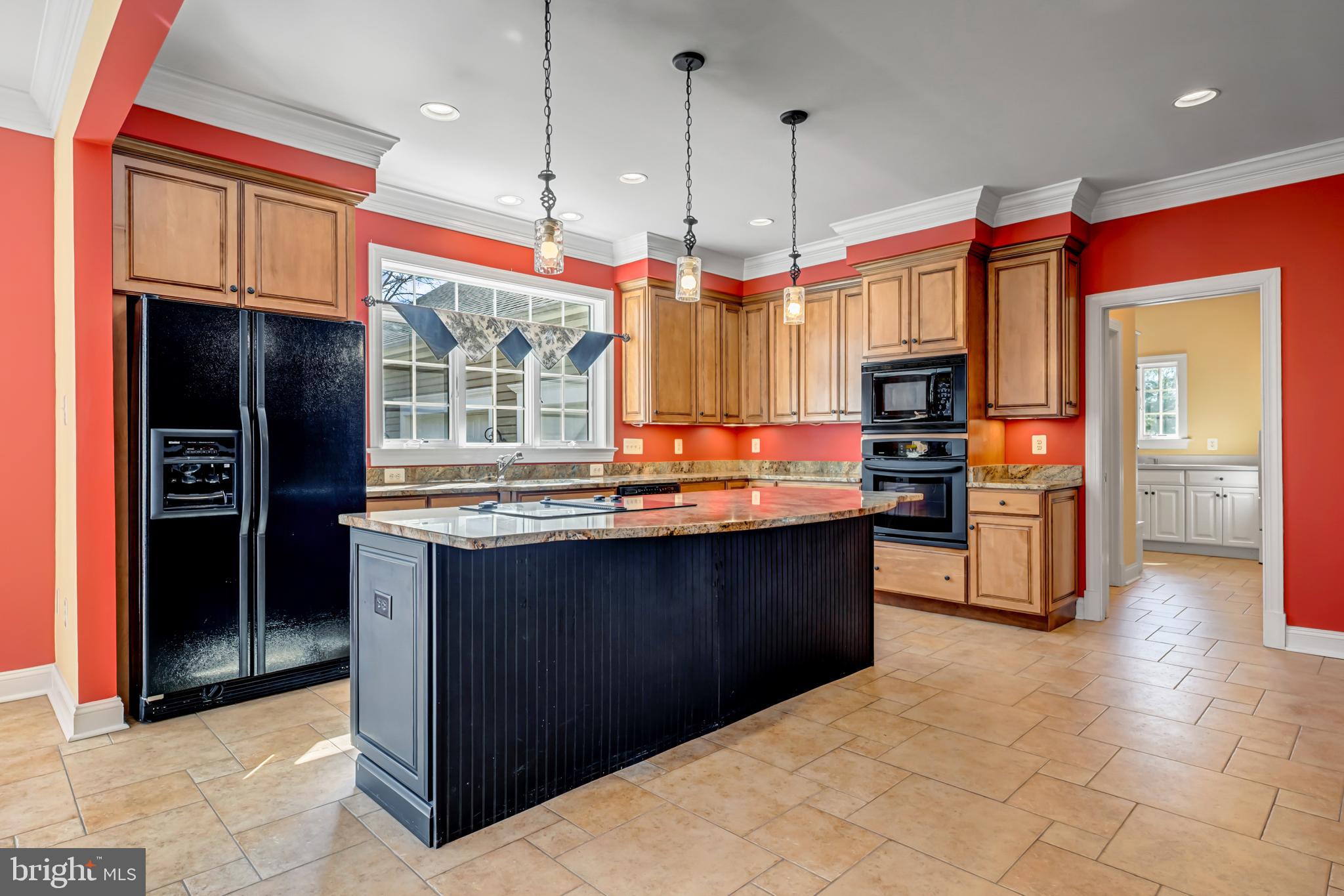 8986 Woodward Road Marshall, VA 20115 - Photo 10 of 45 a kitchen with stainless steel appliances granite countertop a refrigerator and a stove