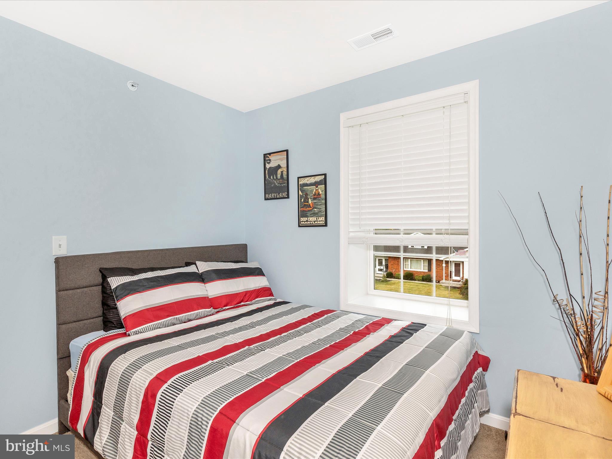 28 Brookside Avenue Hanover, PA 17331 - Photo 18 of 51 a bedroom with a bed and a large window