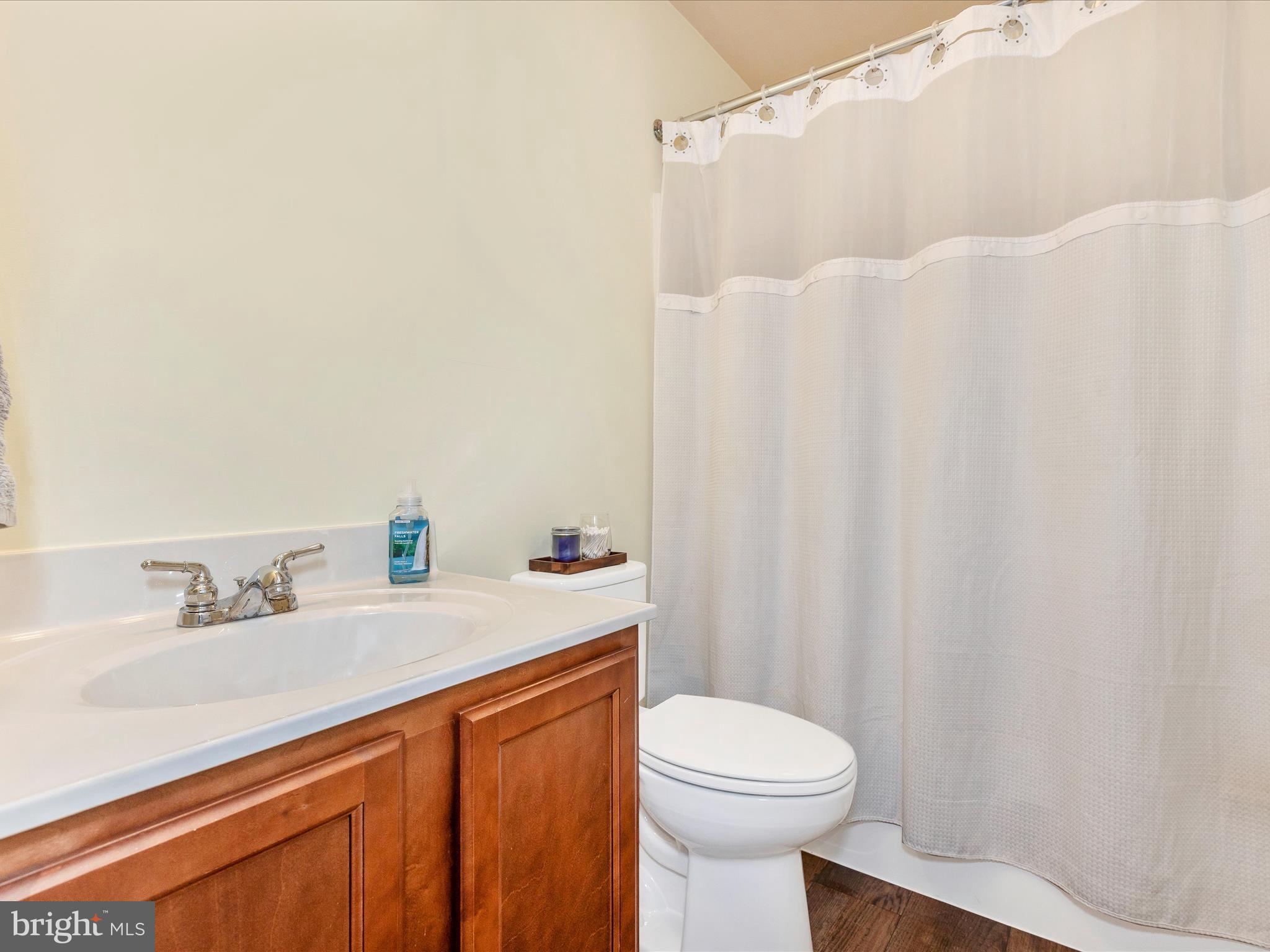 28 Brookside Avenue Hanover, PA 17331 - Photo 22 of 51 a bathroom with a sink a toilet and shower curtain