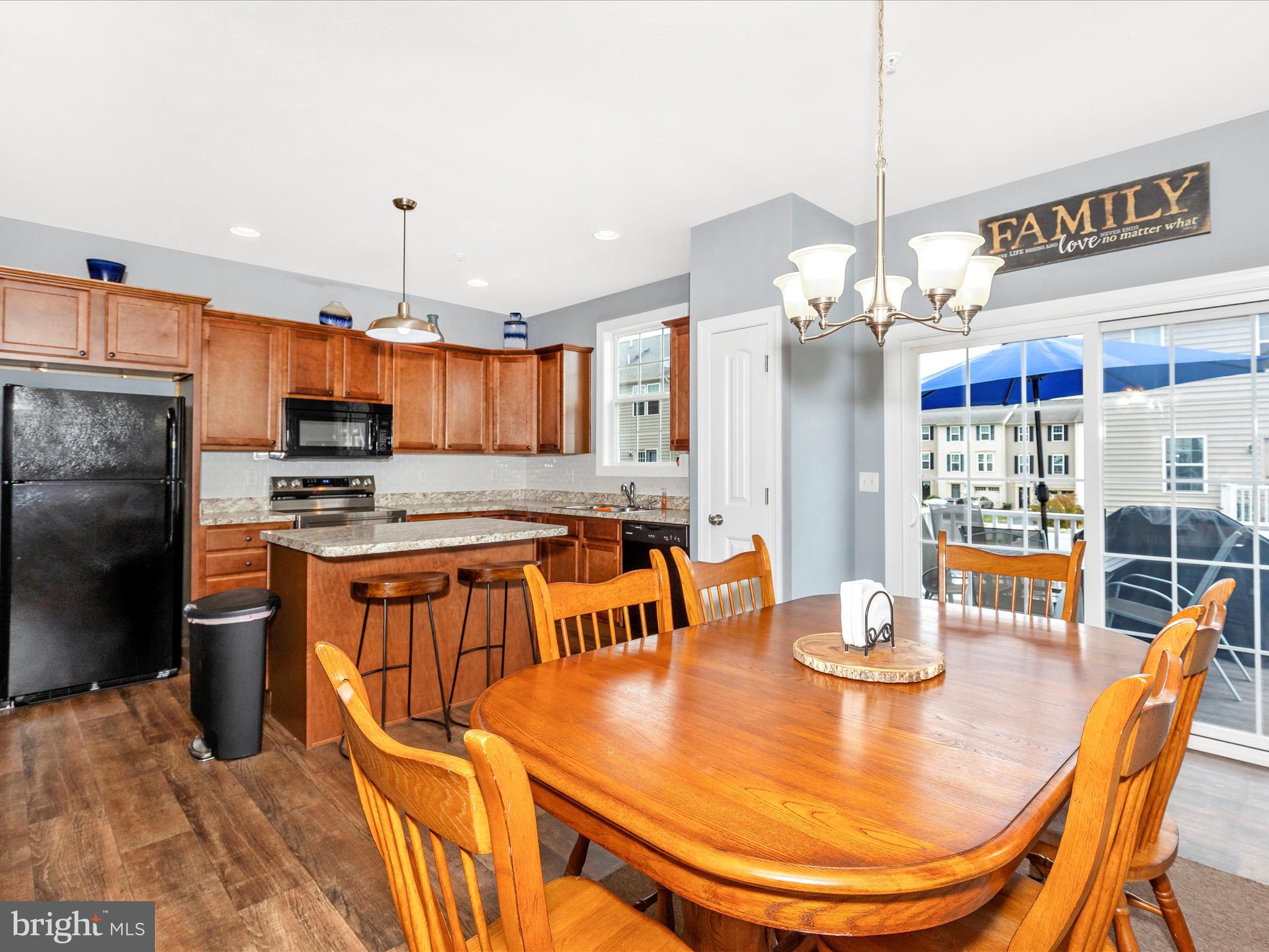 28 Brookside Avenue Hanover, PA 17331 - Photo 25 of 51 a kitchen with stainless steel appliances kitchen island granite countertop a table chairs and a chandelier