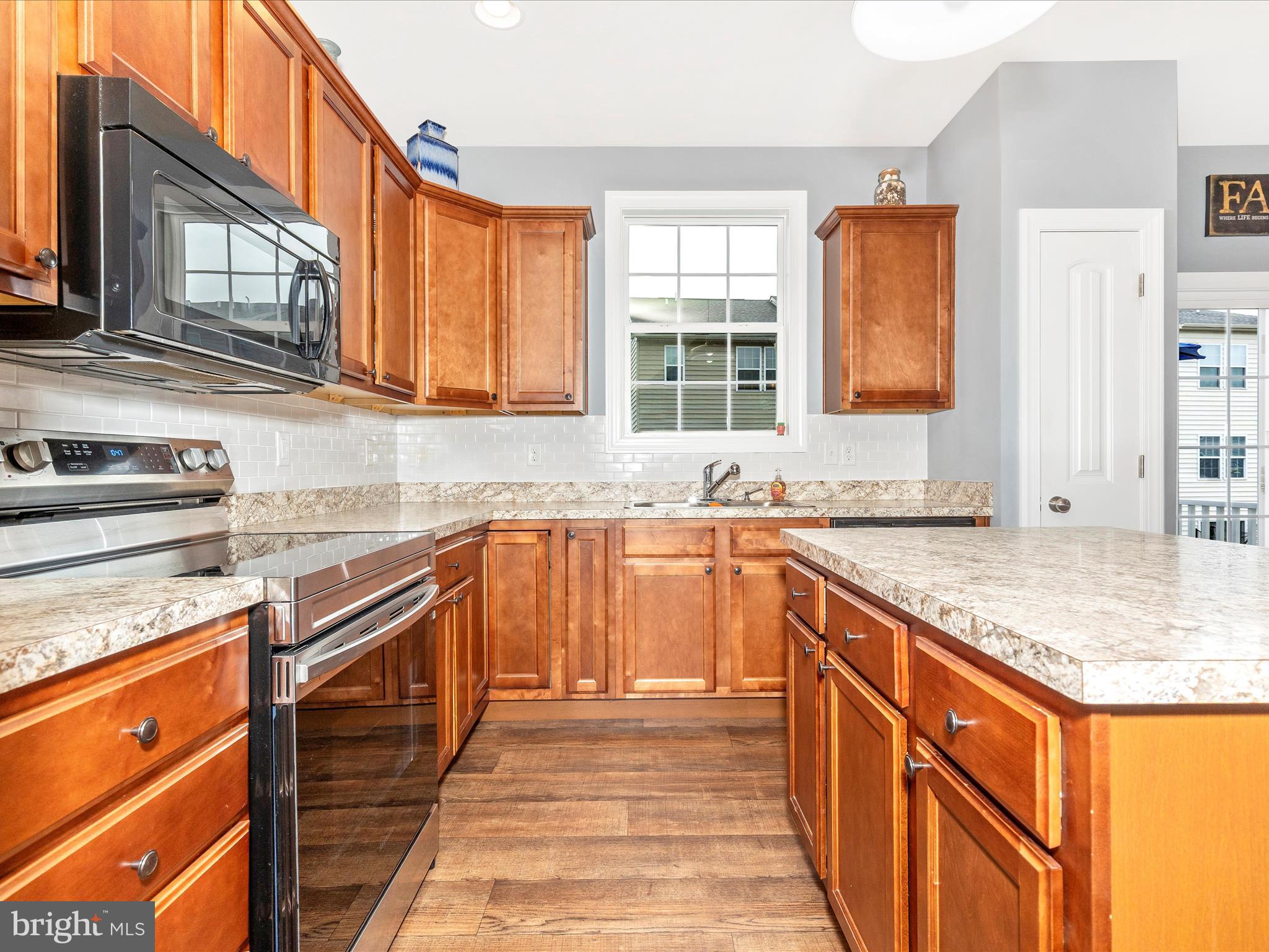 28 Brookside Avenue Hanover, PA 17331 - Photo 32 of 51 a kitchen with stainless steel appliances granite countertop a sink stove and cabinets