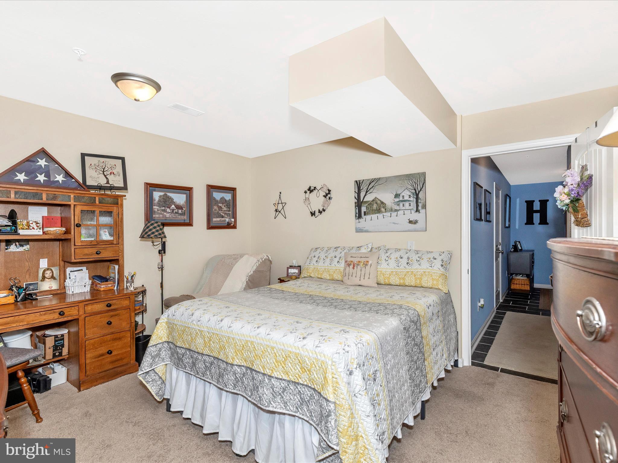28 Brookside Avenue Hanover, PA 17331 - Photo 7 of 51 a bedroom with a bed and a book shelf
