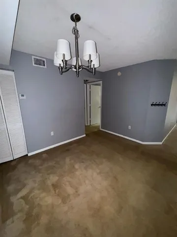 a kitchen with a stove and a refrigerator