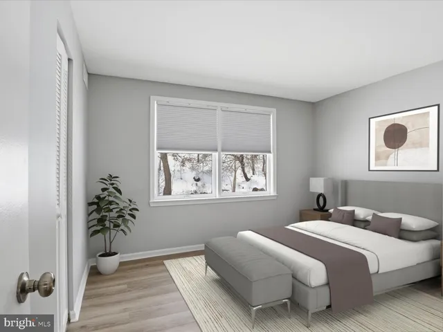 a bedroom with bed and a window