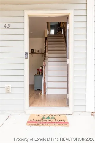 a living room with fireplace furniture and a flat screen tv