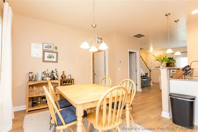 a bathroom with a sink mirror and toilet